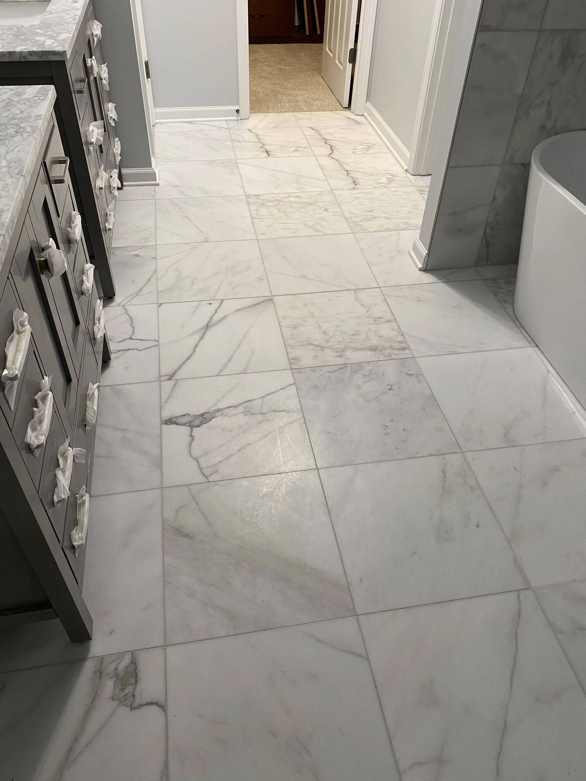 Tile floor installation in modern kitchen